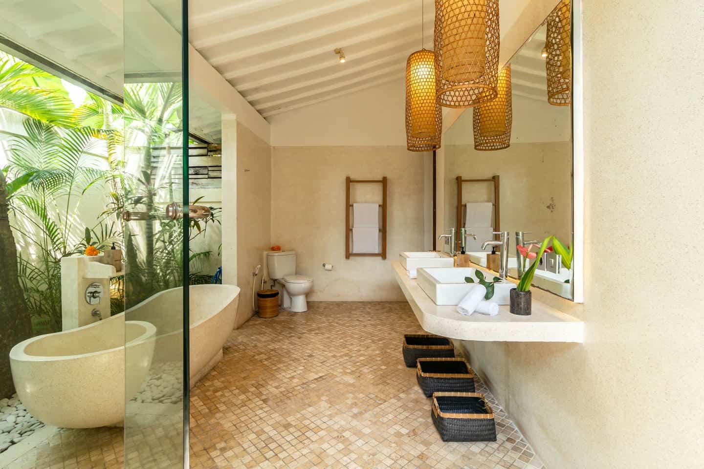Modern bathroom with tub and glass panel