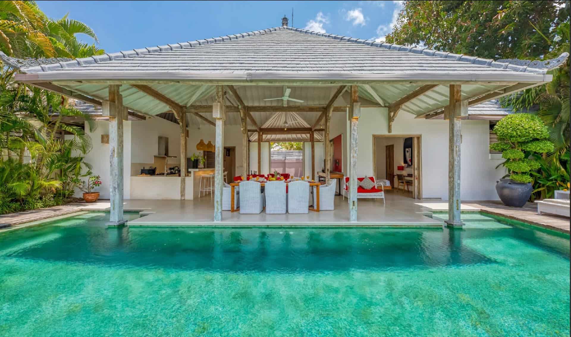 Luxury open-air villa with pool and garden.