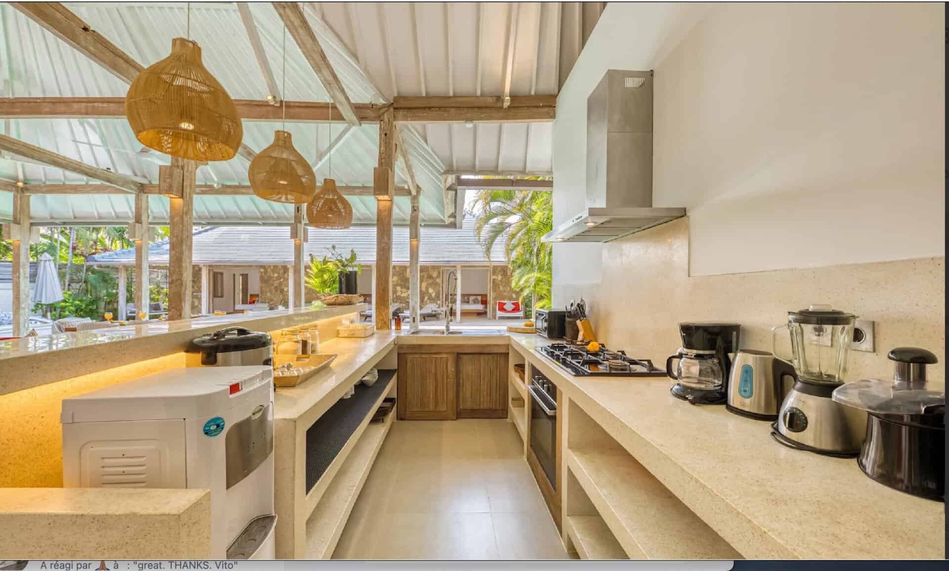 Modern open kitchen with appliances and island.