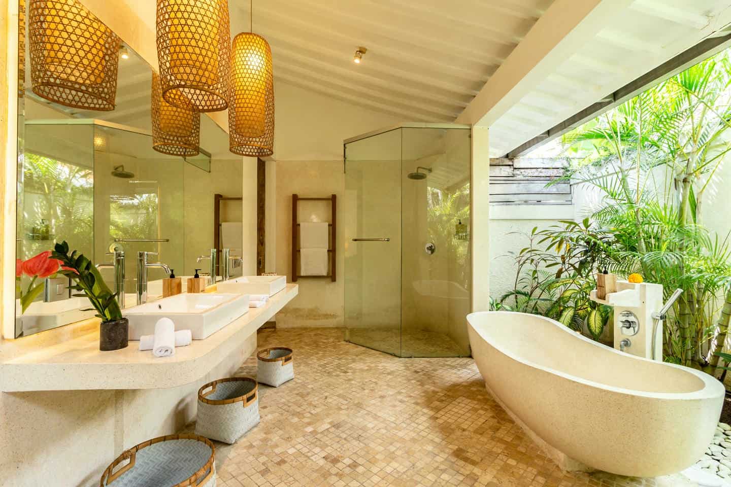 Luxurious outdoor bathroom with bathtub and plants