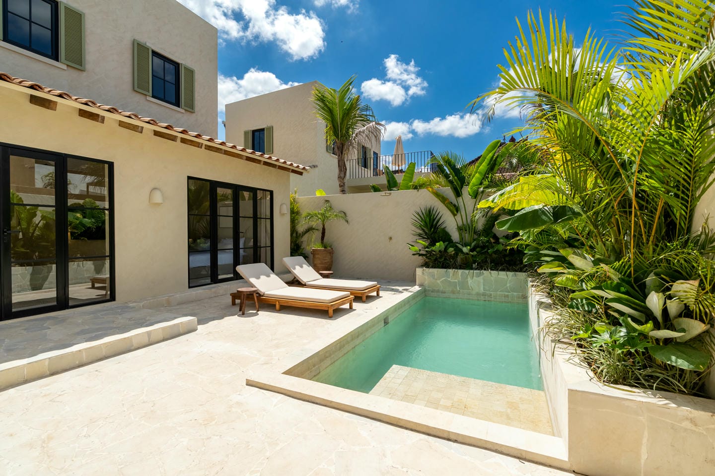 Modern villa with pool and lush greenery