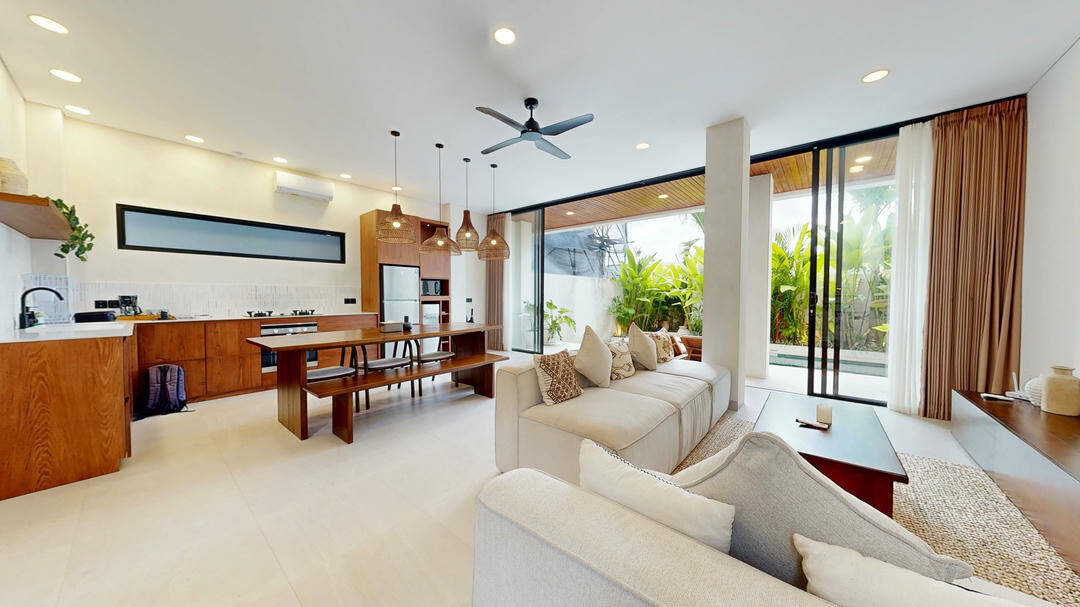 Modern open living room with garden view.