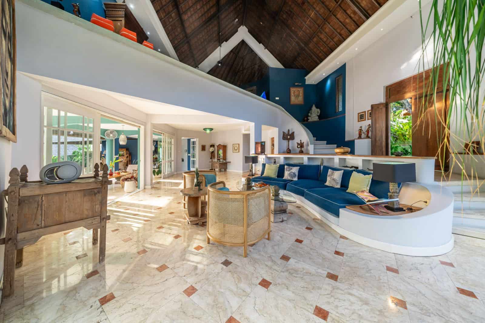 Spacious living room with modern decor and high ceiling