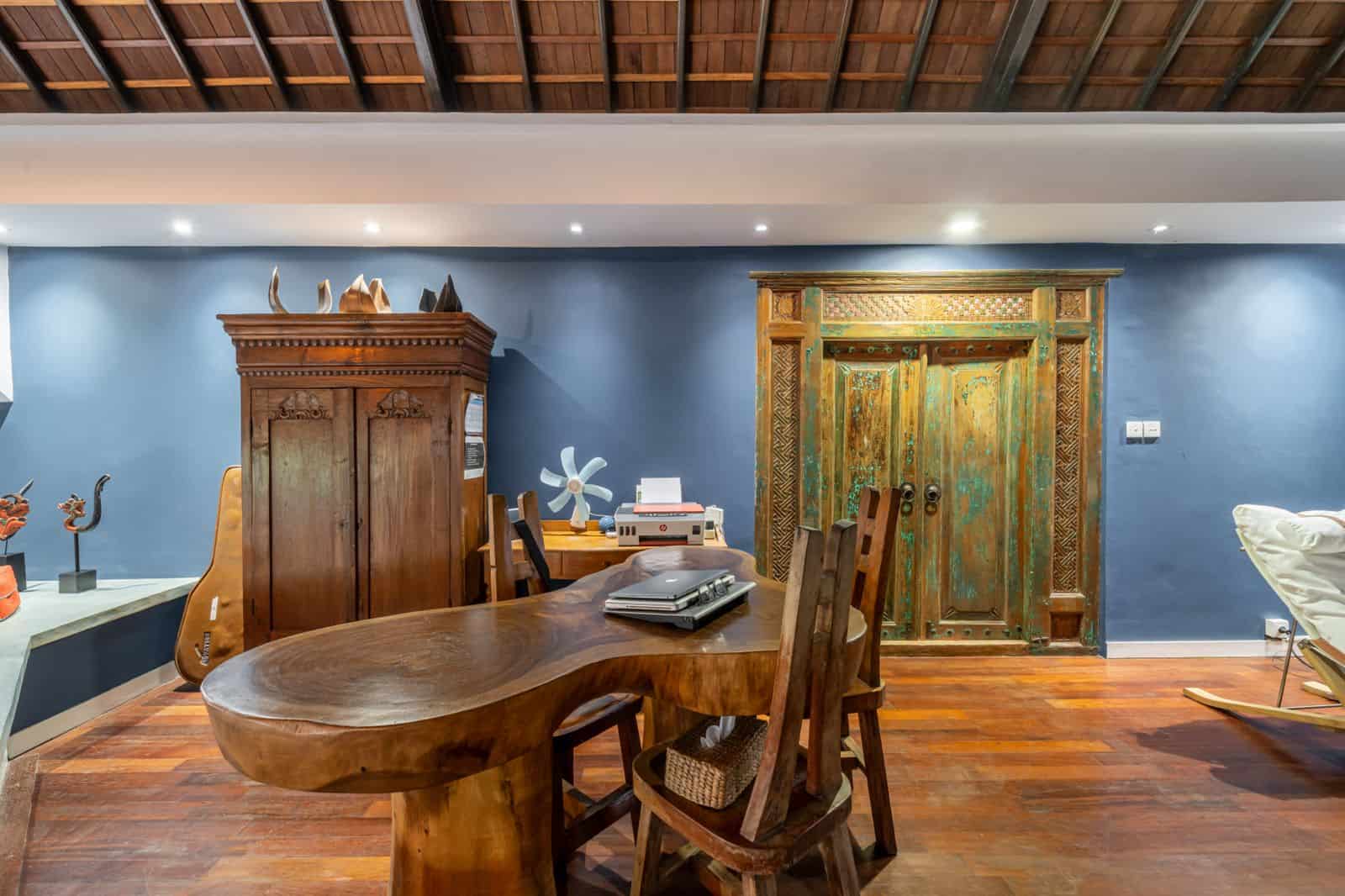 Rustic home office with wooden furniture and decor.