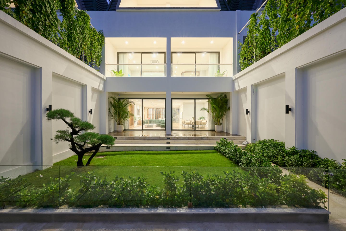 Modern house with garden and glass doors