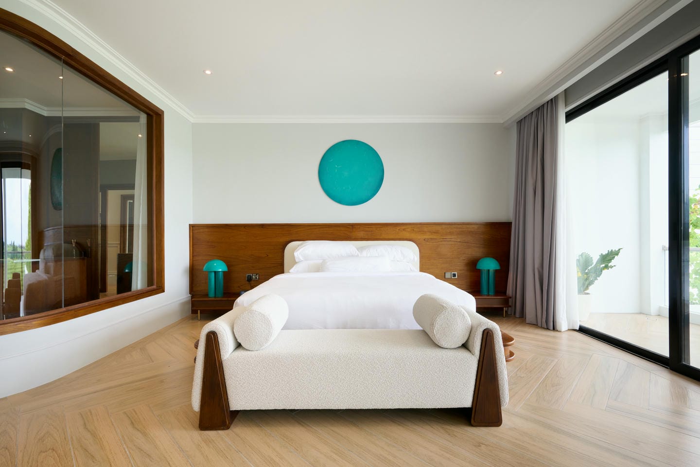 Modern bedroom with large window and cozy bed.