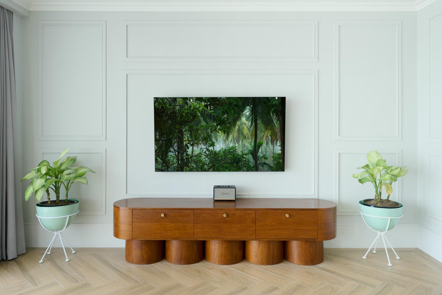 Modern living room with wooden sideboard and plants