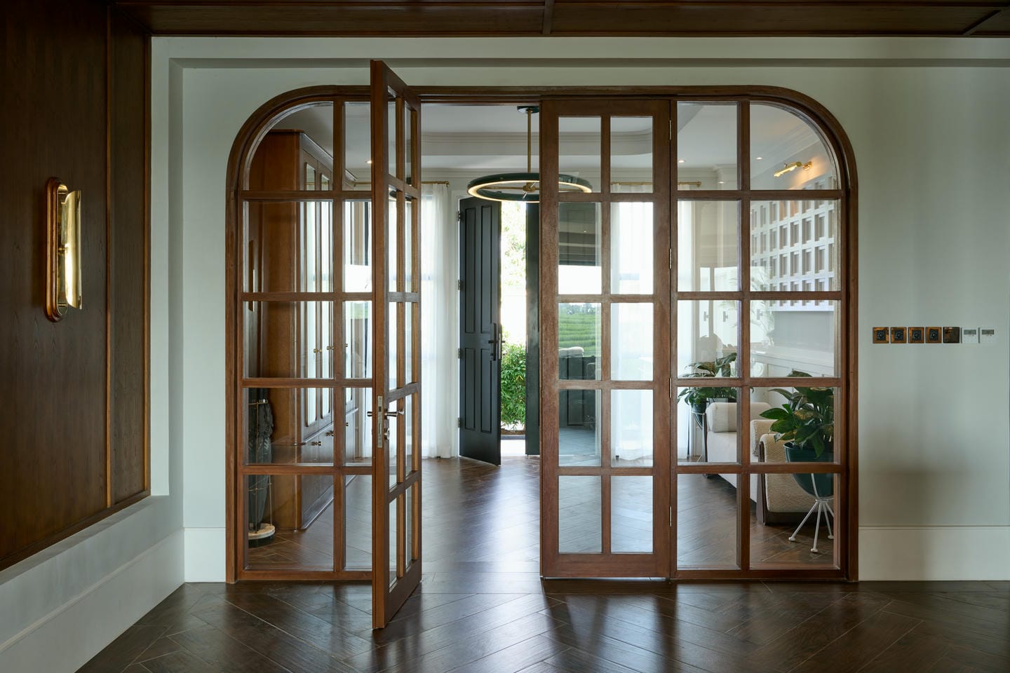 Stylish wooden doors in modern living room.