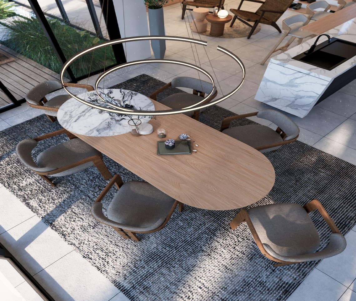 Modern dining room with oval table and chairs.