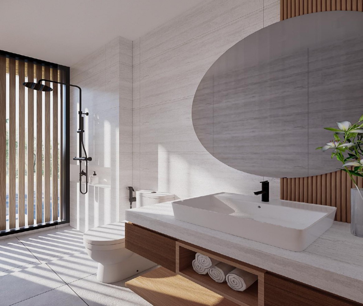 Modern bathroom with shower and large mirror.