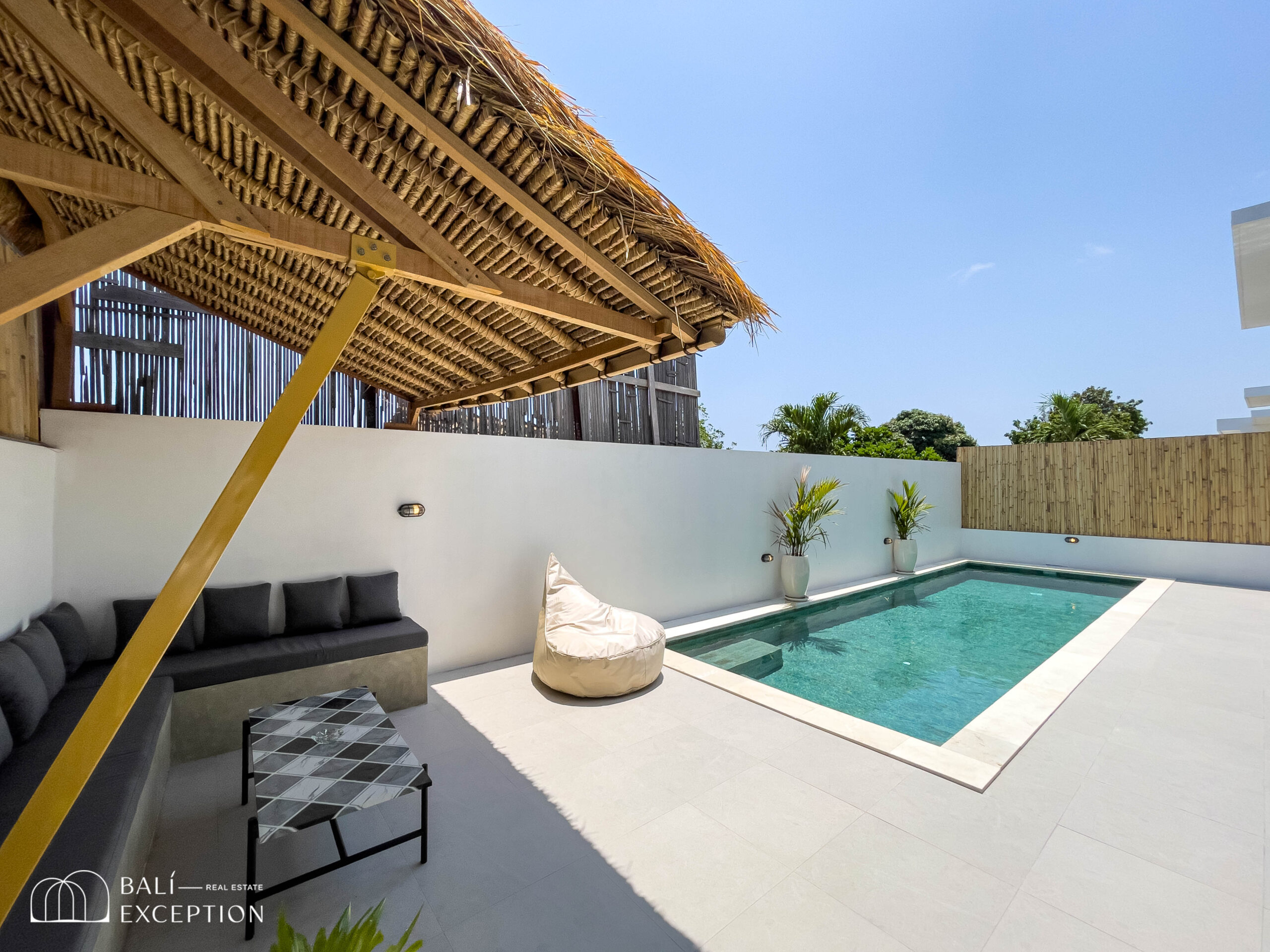 Modern patio with pool and lounge area