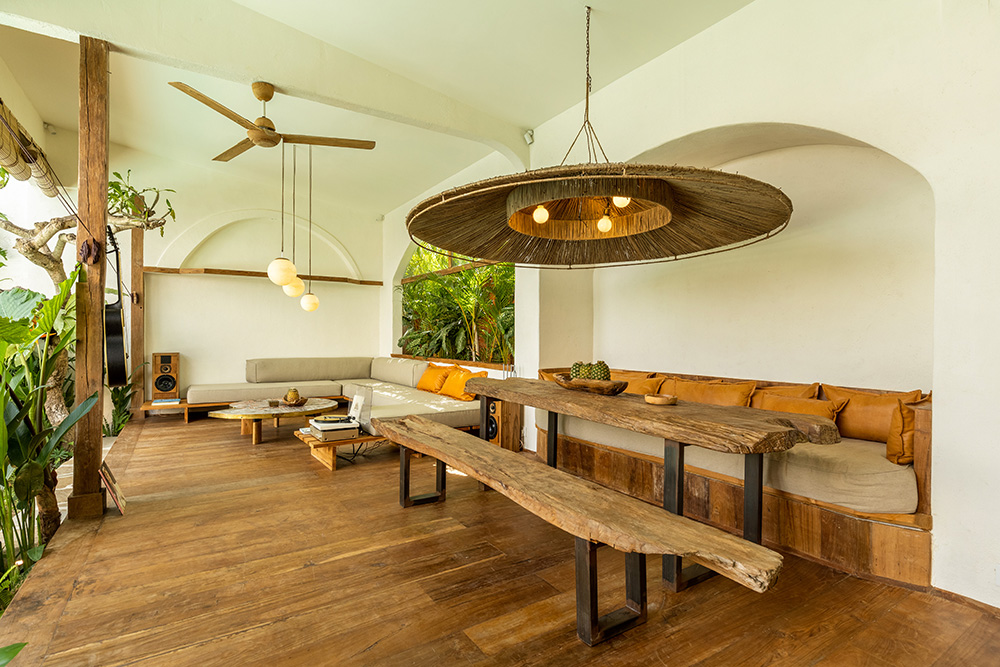 Cozy wooden patio with modern seating and decor.