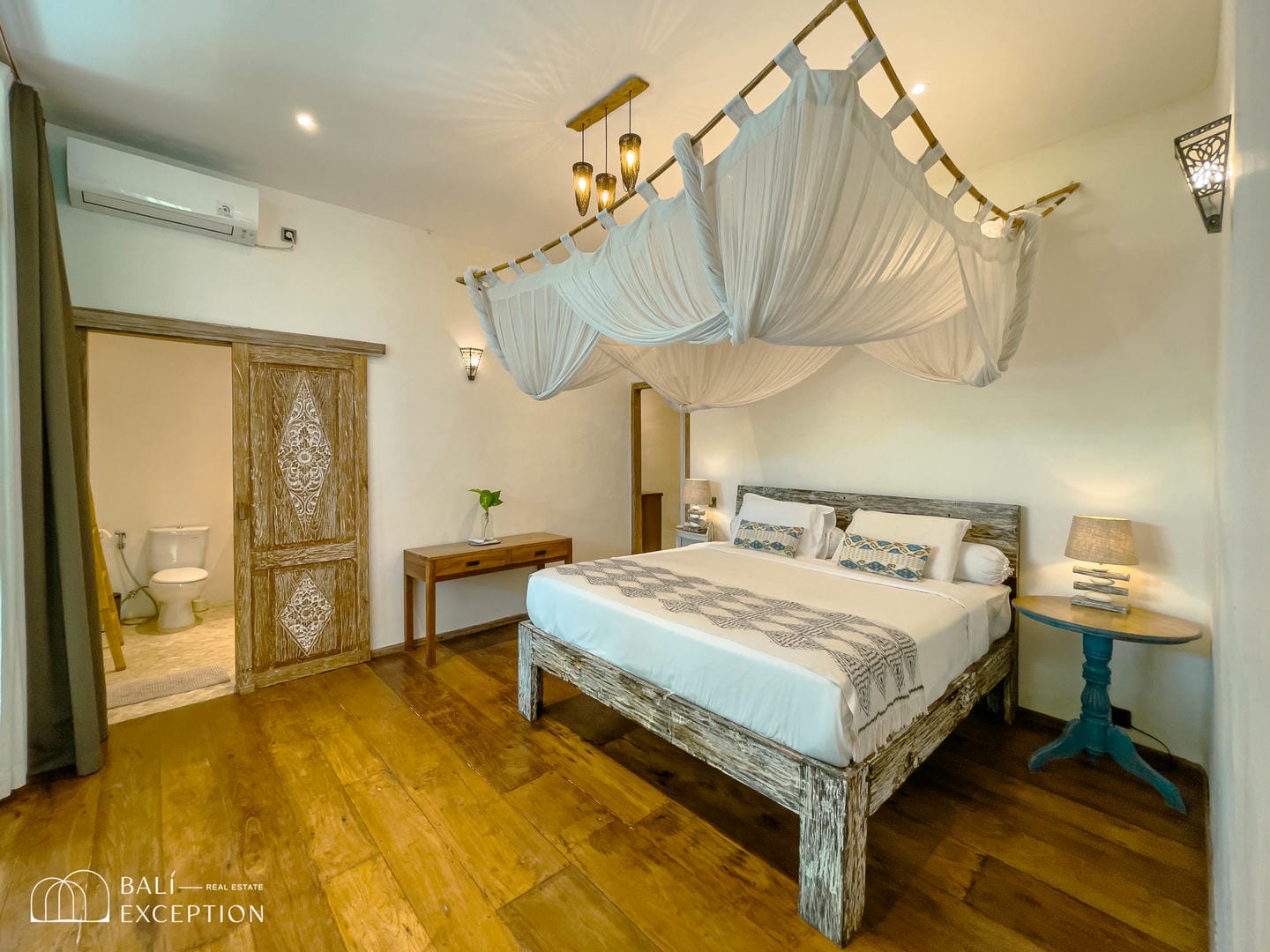 Luxurious bedroom with canopy bed and rustic decor
