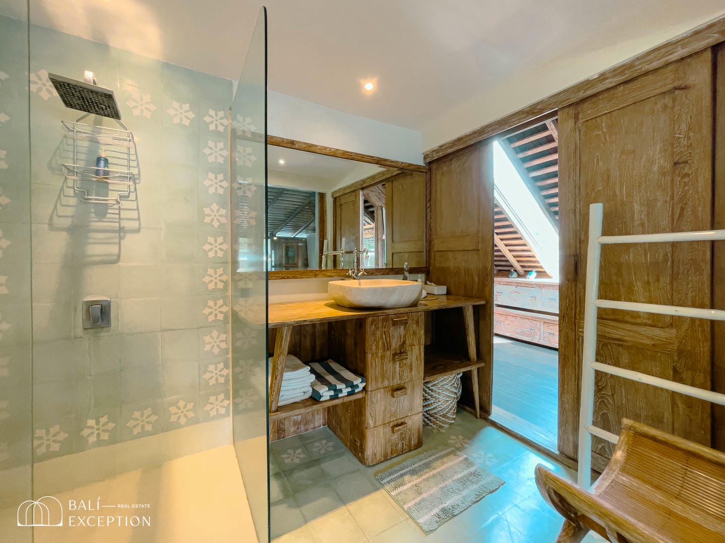 Modern rustic bathroom with wooden fixtures.