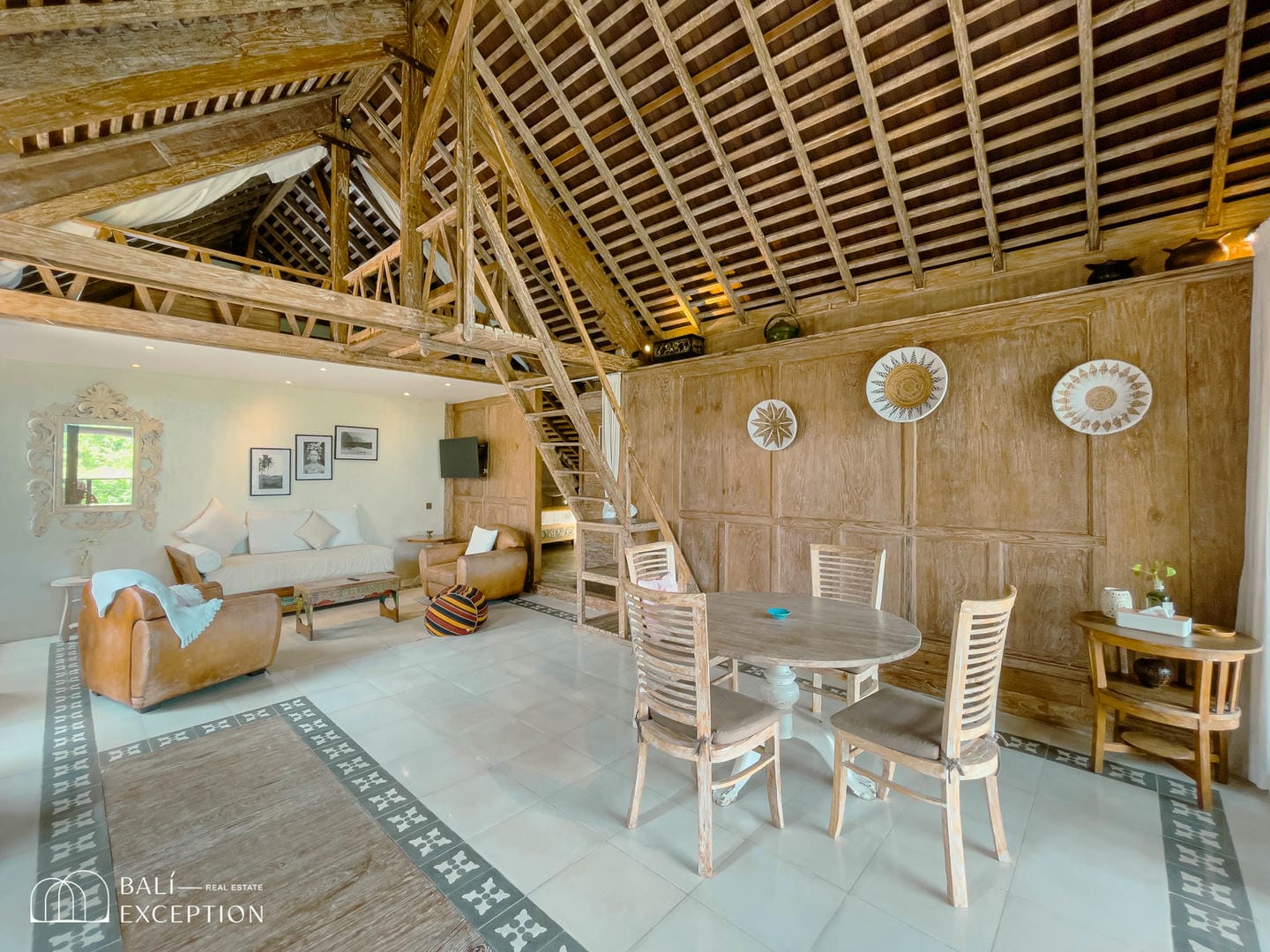 Rustic living room with wooden decor and seating.