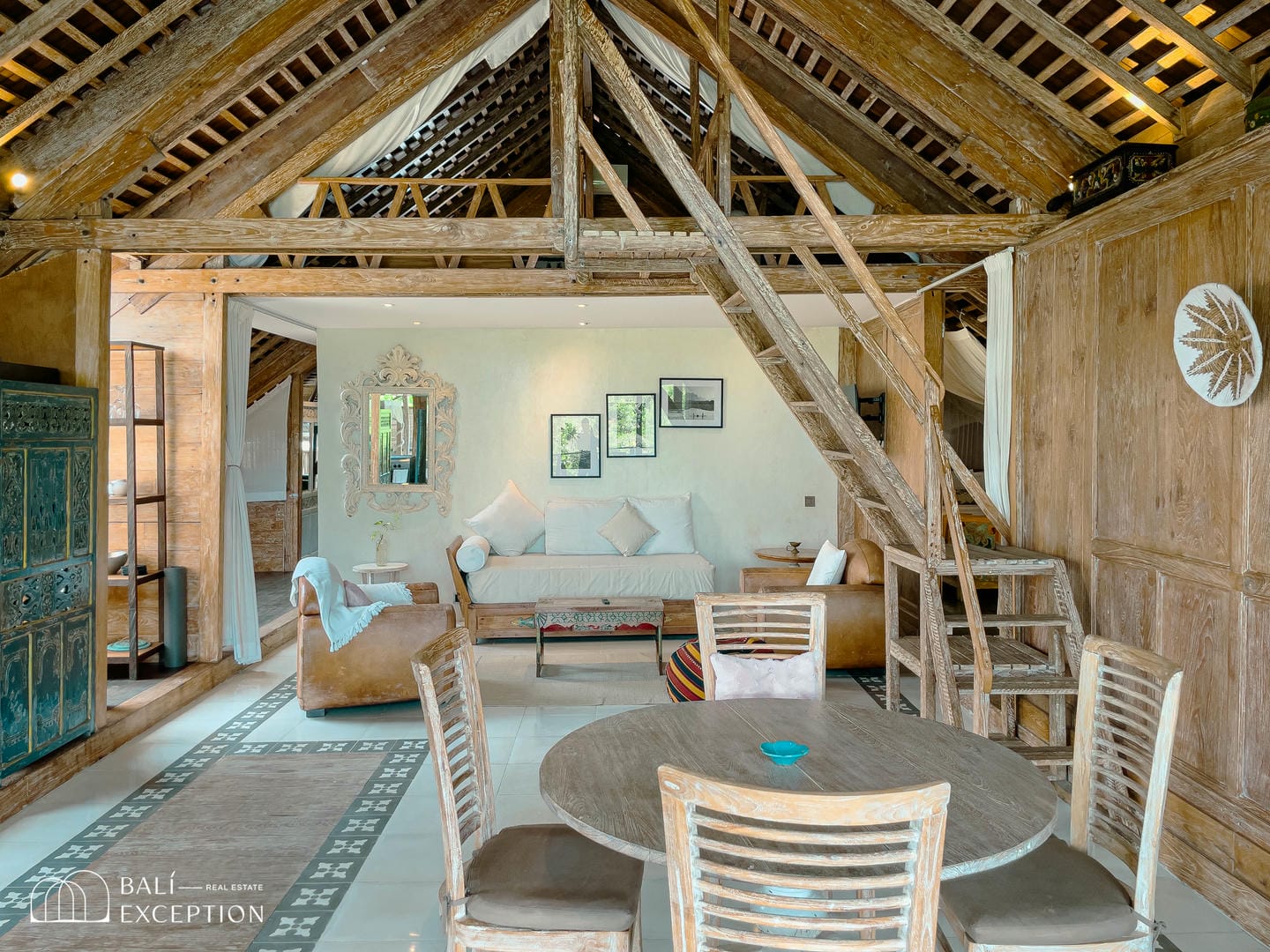 Rustic wooden loft interior with seating and decor.