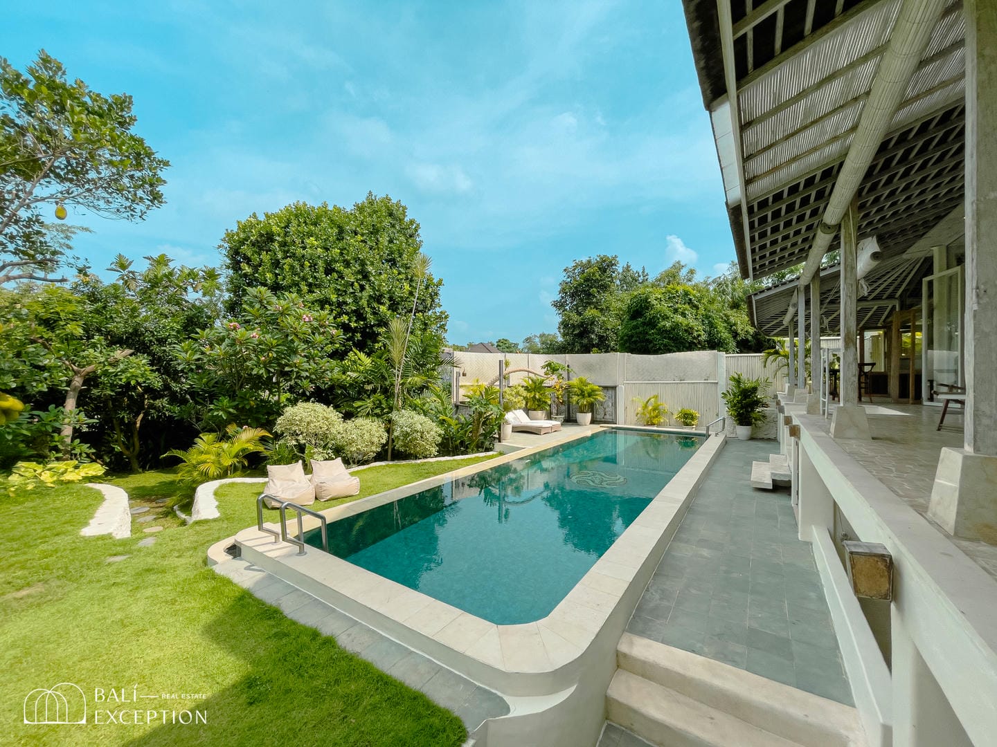 Luxury villa with pool and garden view.
