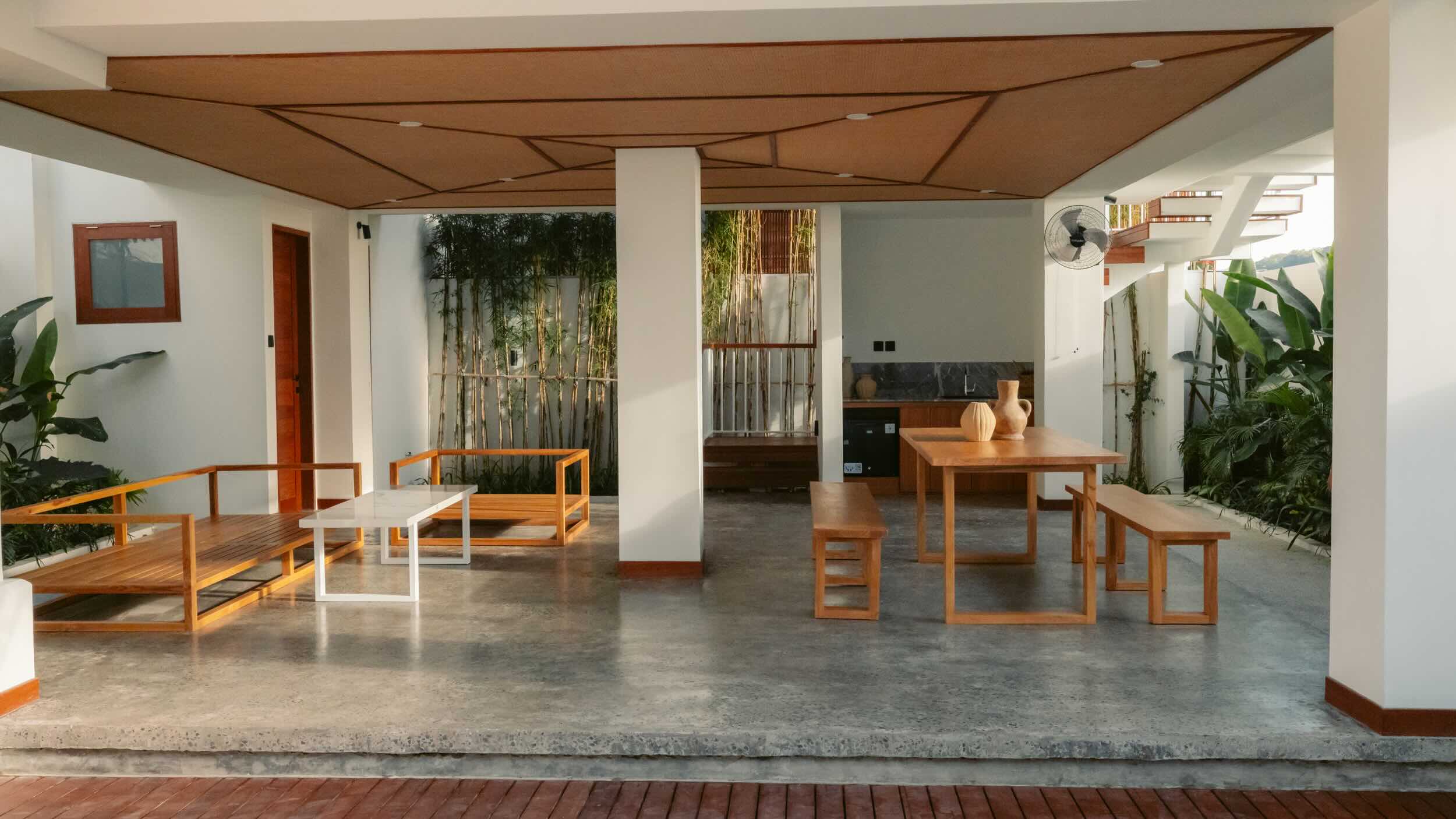 Modern outdoor patio with wooden furniture