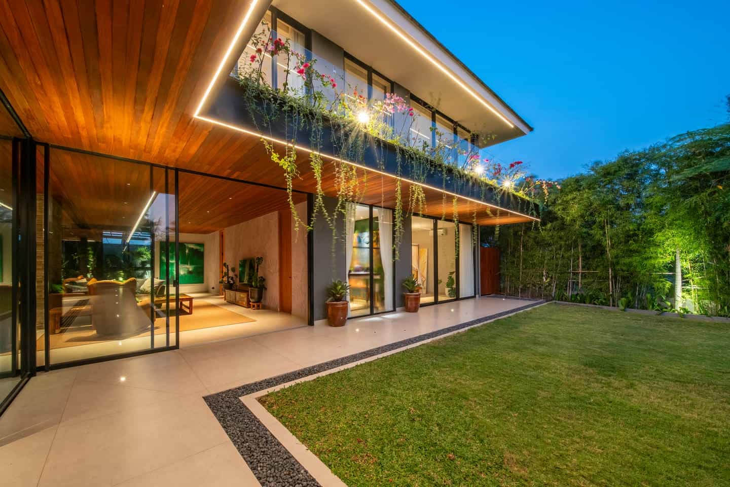 Modern home with glass walls and garden