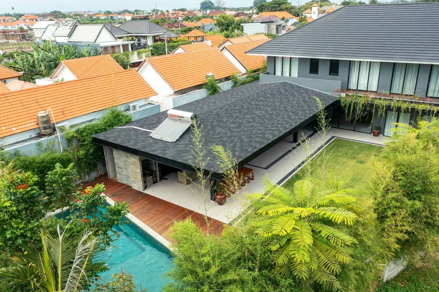 Modern house with pool and garden aerial view.