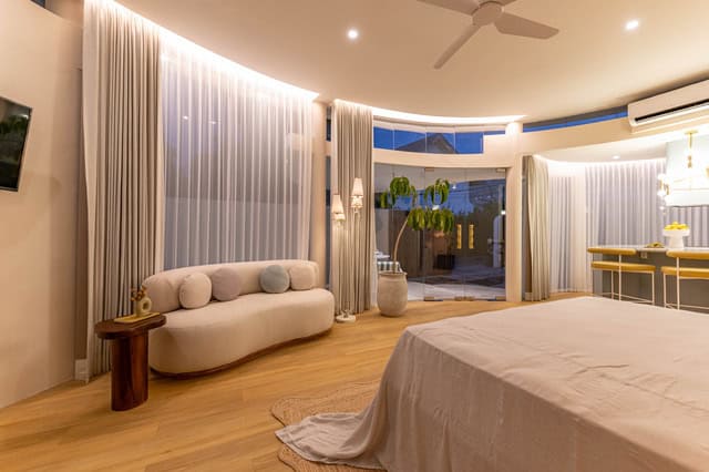 Luxurious modern bedroom with elegant decor and lighting.