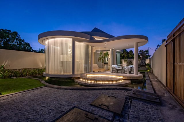 Modern round house with evening lighting