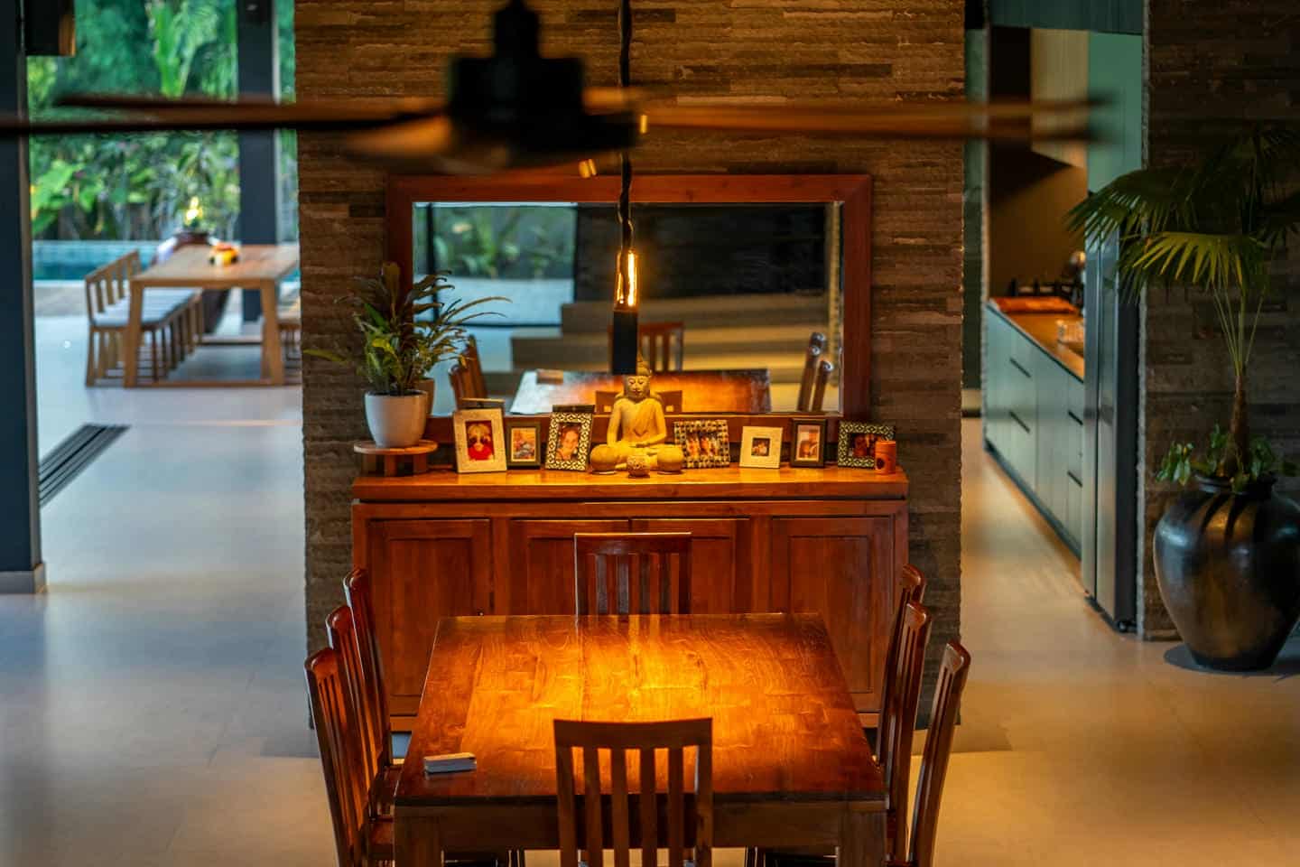 Cozy dining room with table and wooden chairs.