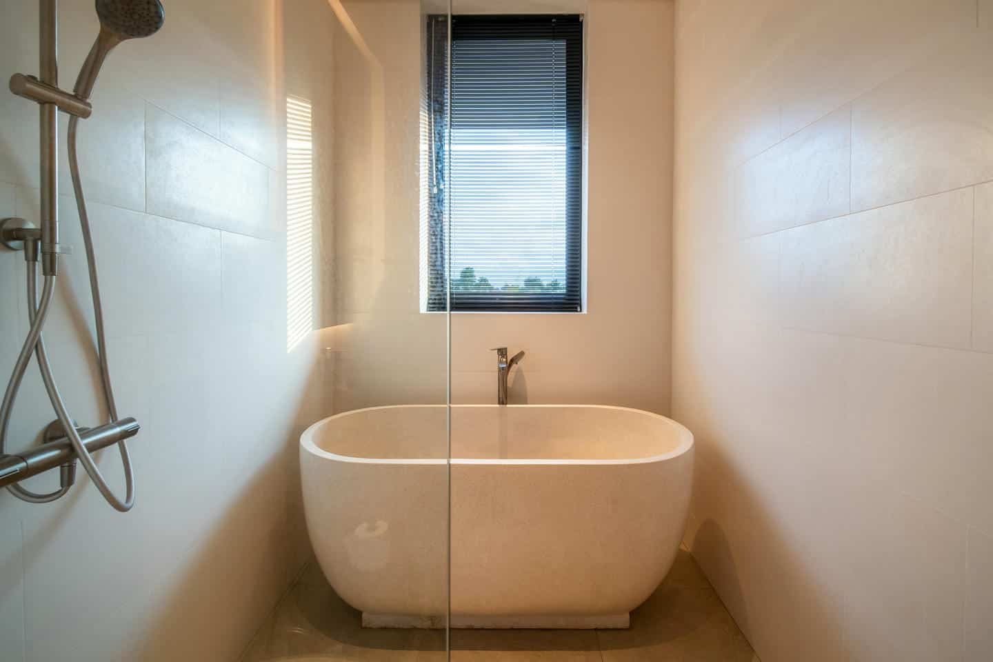 Modern minimalist bathroom with bathtub and shower
