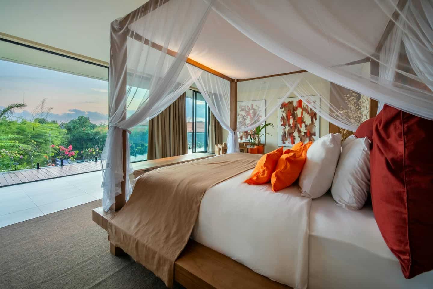 Luxurious bedroom with scenic outdoor view.