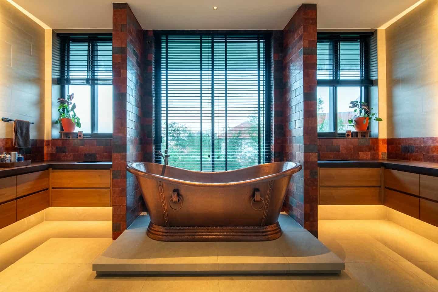 Luxury bathroom with freestanding copper bathtub.