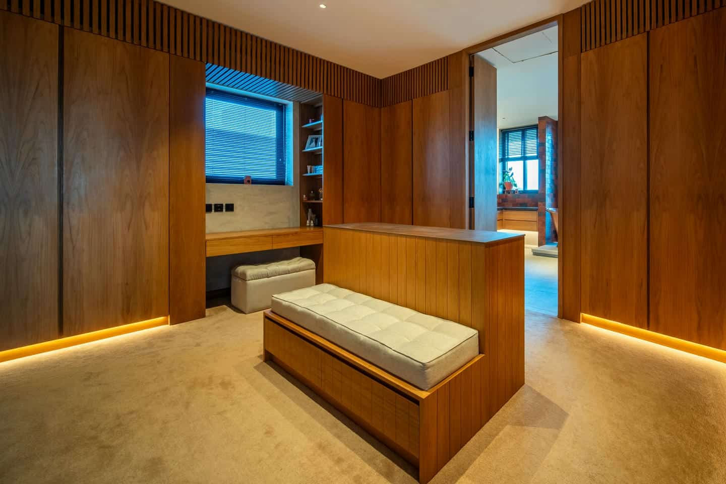 Modern wooden room with seating and shelves