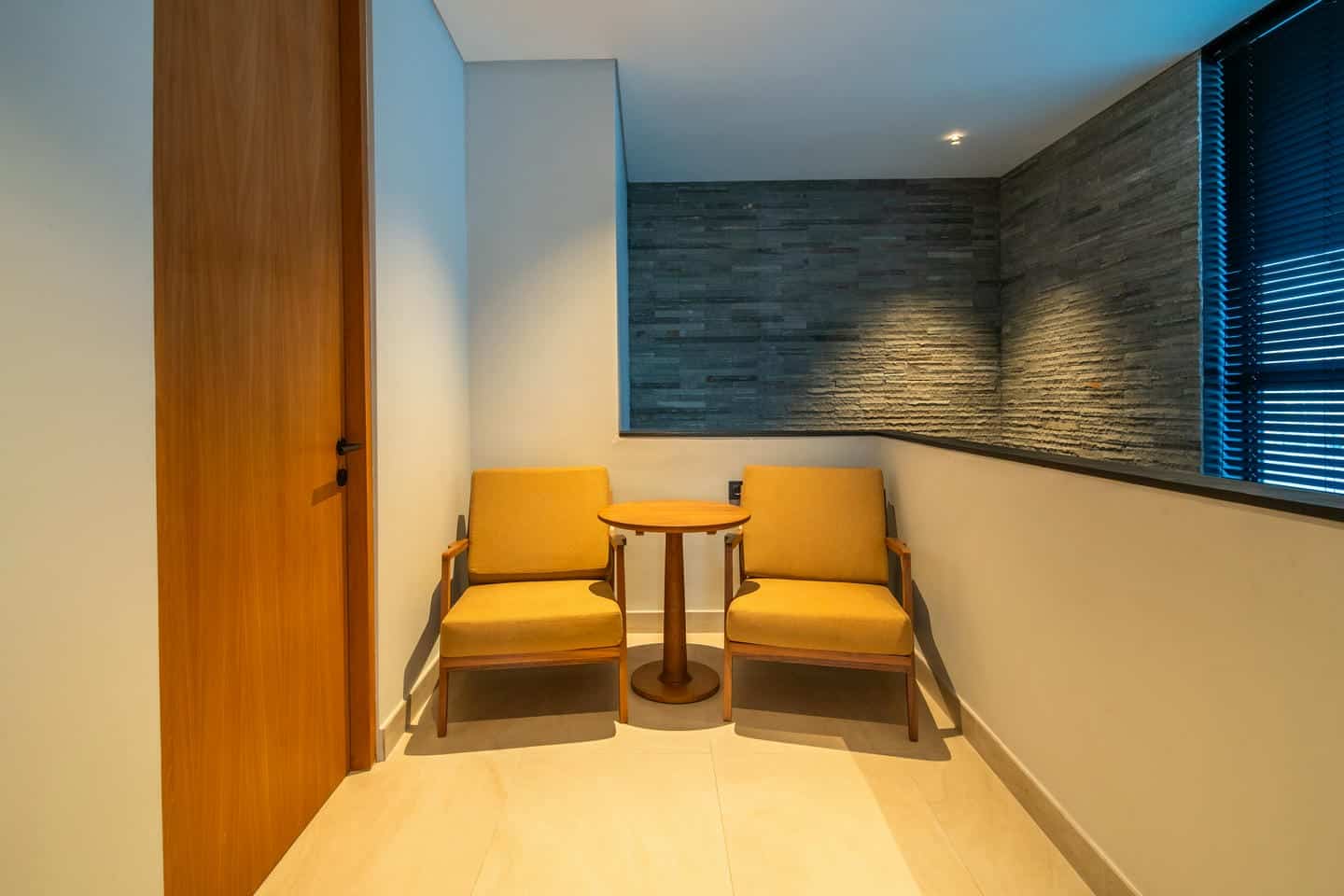 Cozy seating area with chairs and small table.