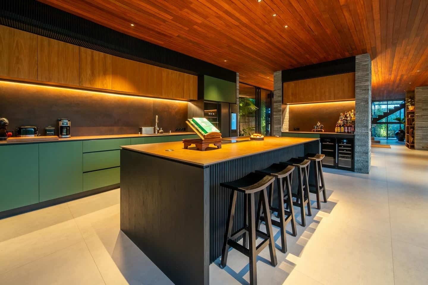 Modern kitchen with wooden ceiling and island counter.