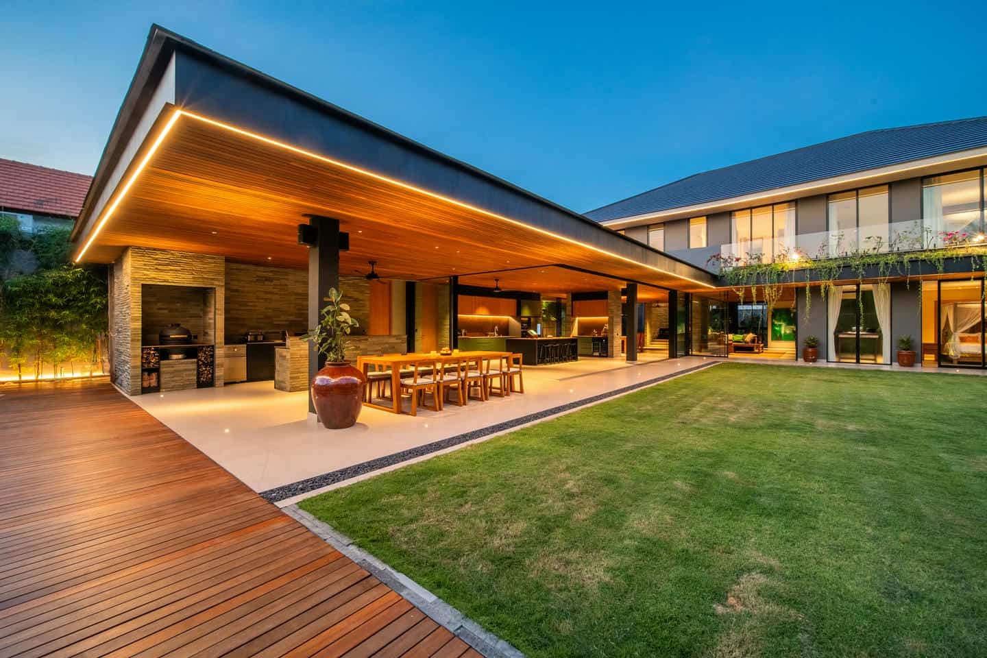 Modern house with open patio and garden view.