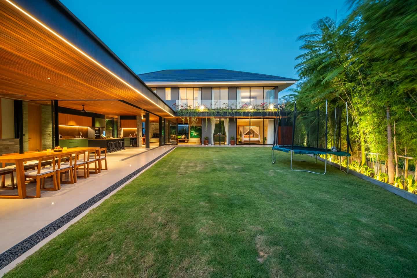 Modern house with garden at dusk