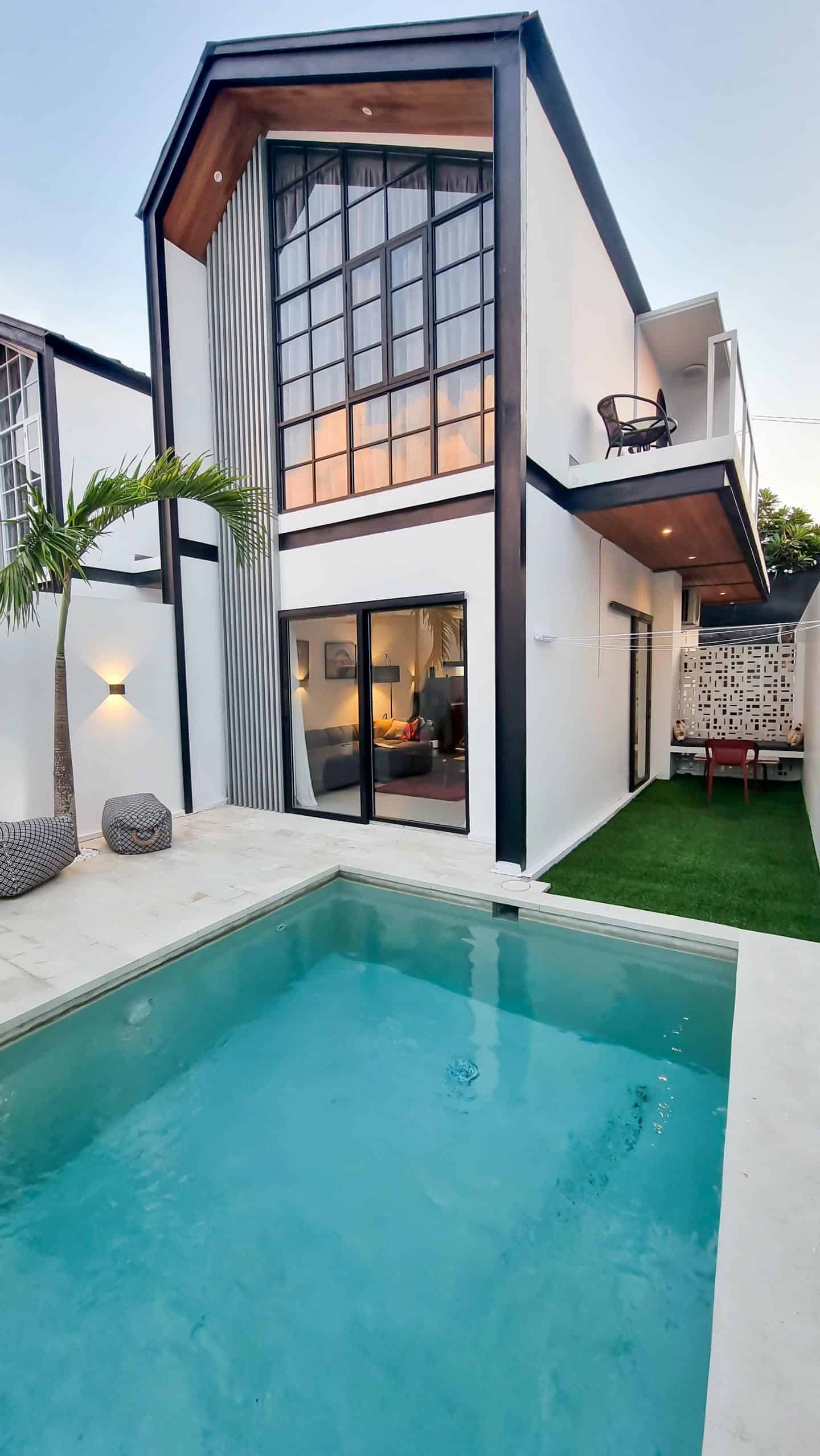 Modern house with pool and patio area.