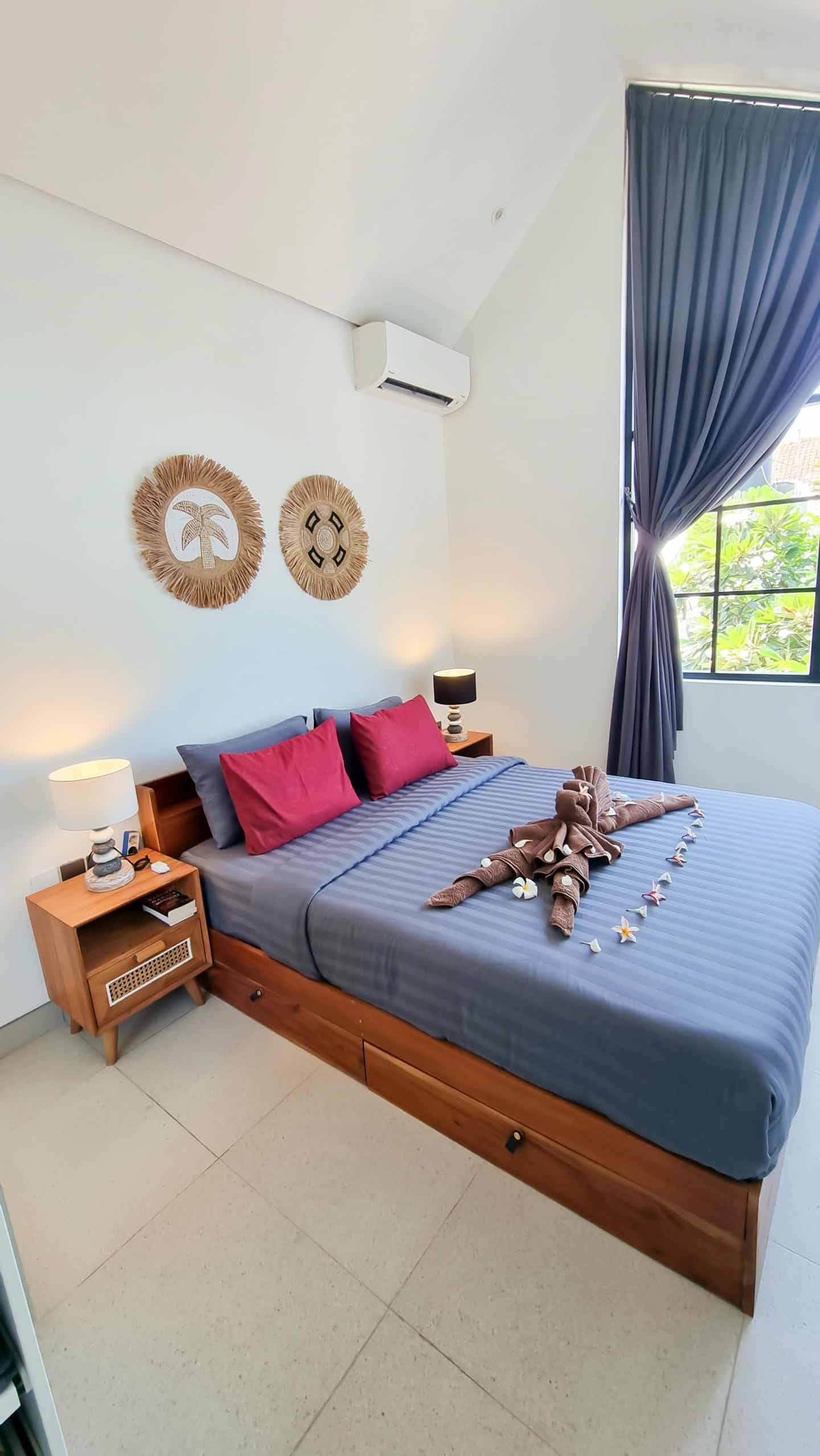 Cozy bedroom with bed and decorative accents.