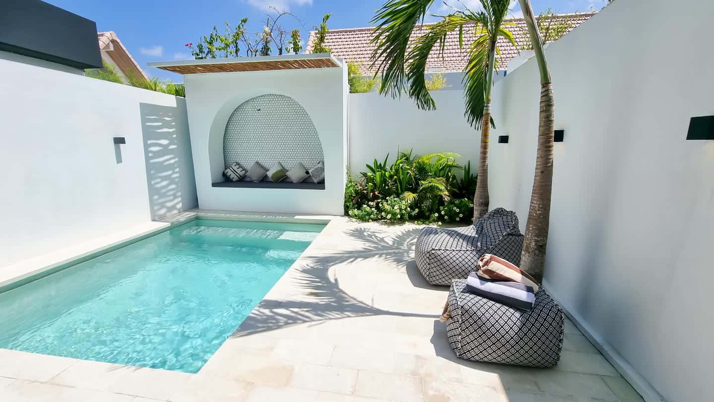 Modern backyard with pool and lounge chairs