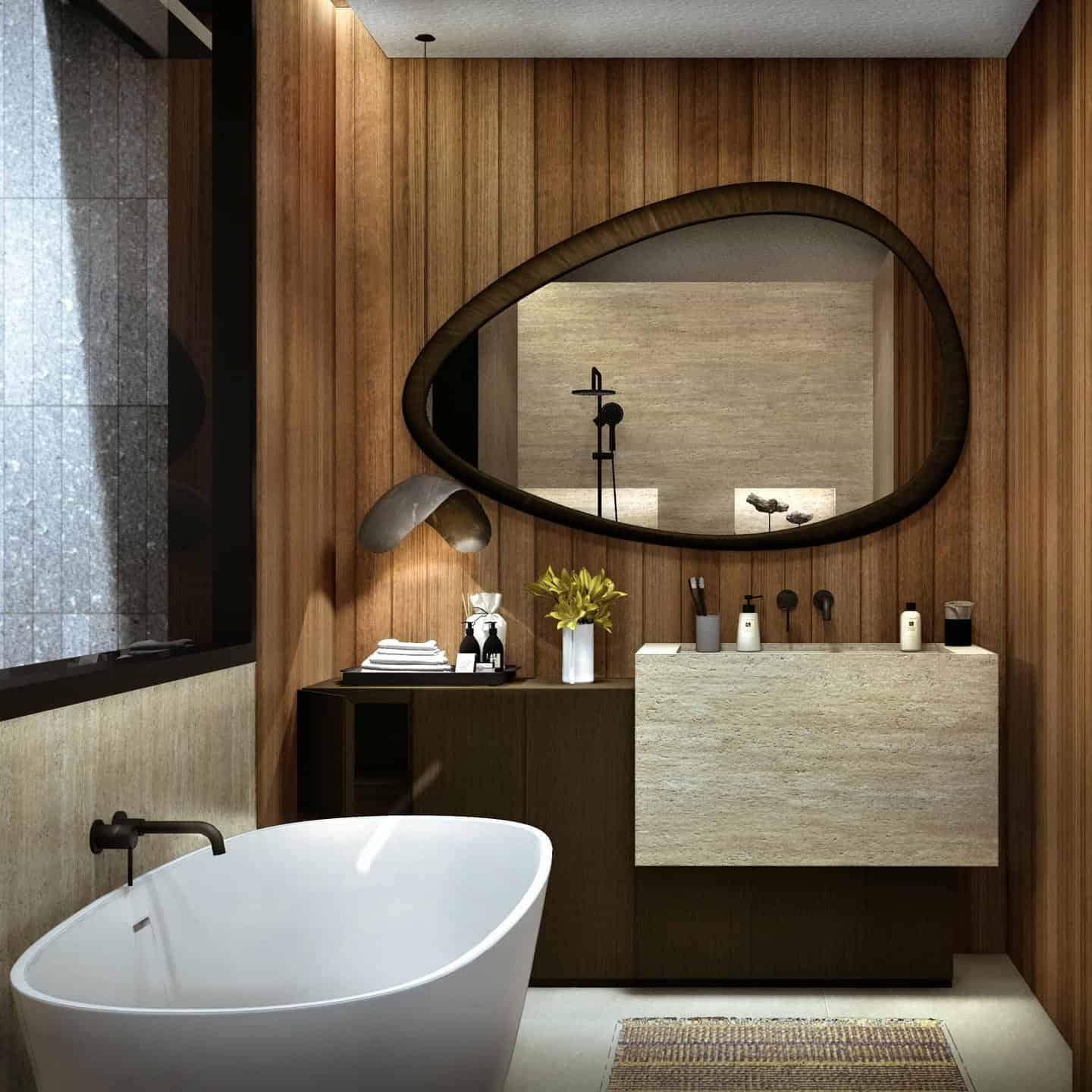 Modern bathroom with wooden accents and oval mirror.