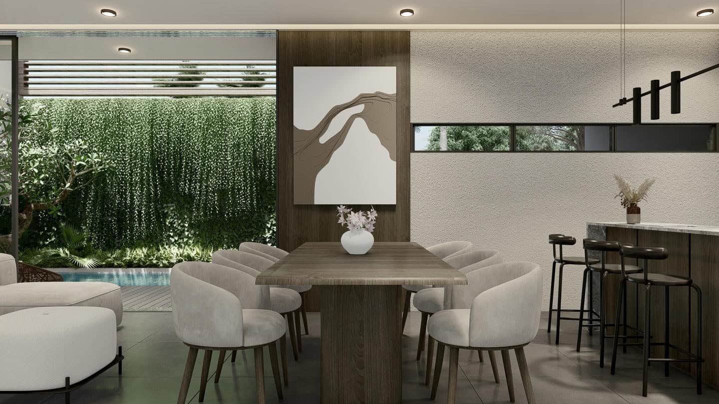 Modern dining area with neutral tones and patio view.