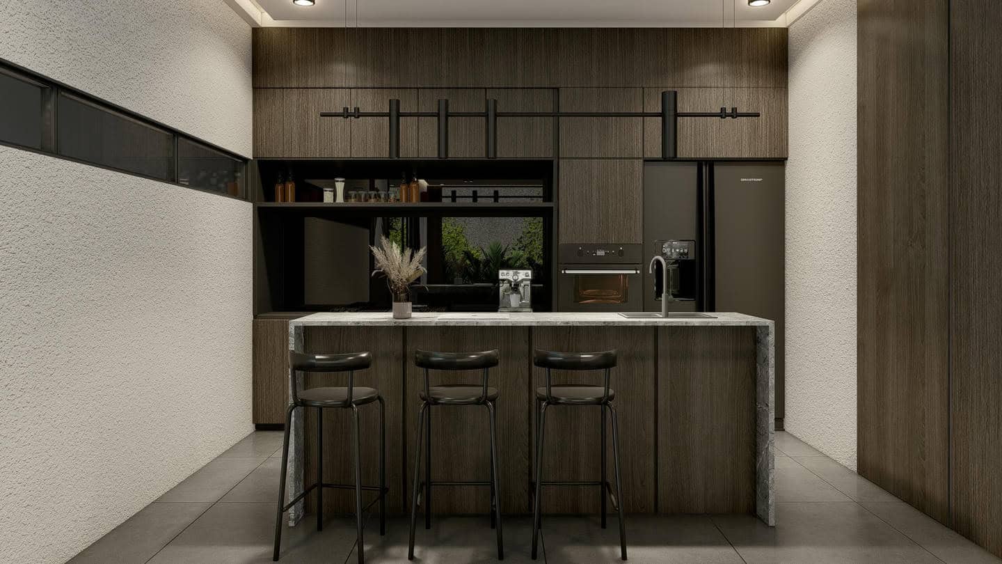 Modern kitchen with wooden cabinets and bar stools.