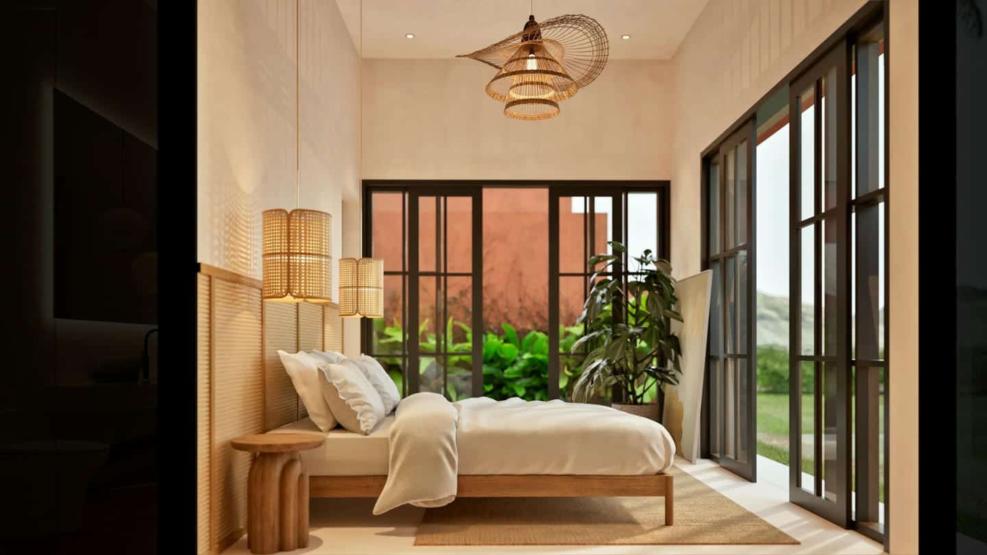 Cozy bedroom with large windows and plants.