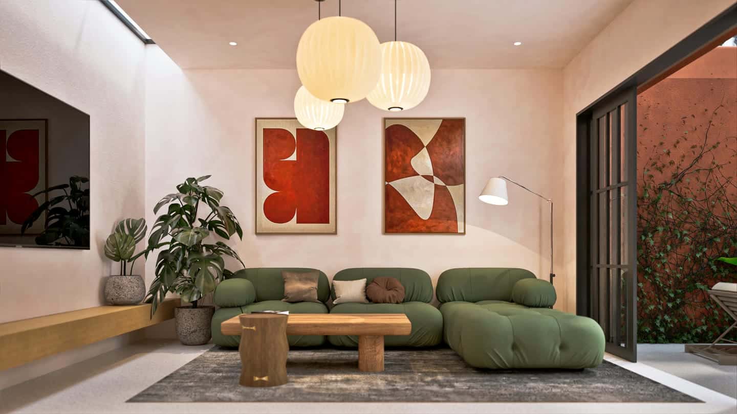Modern living room with green sofa and art.