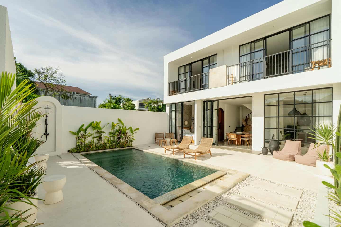 Modern villa with outdoor pool and patio area.