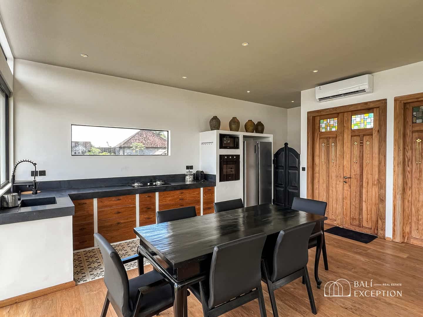 Modern kitchen and dining area with wooden accents