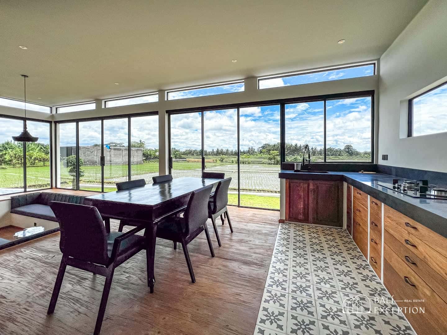 Spacious dining area with large windows and countryside view.