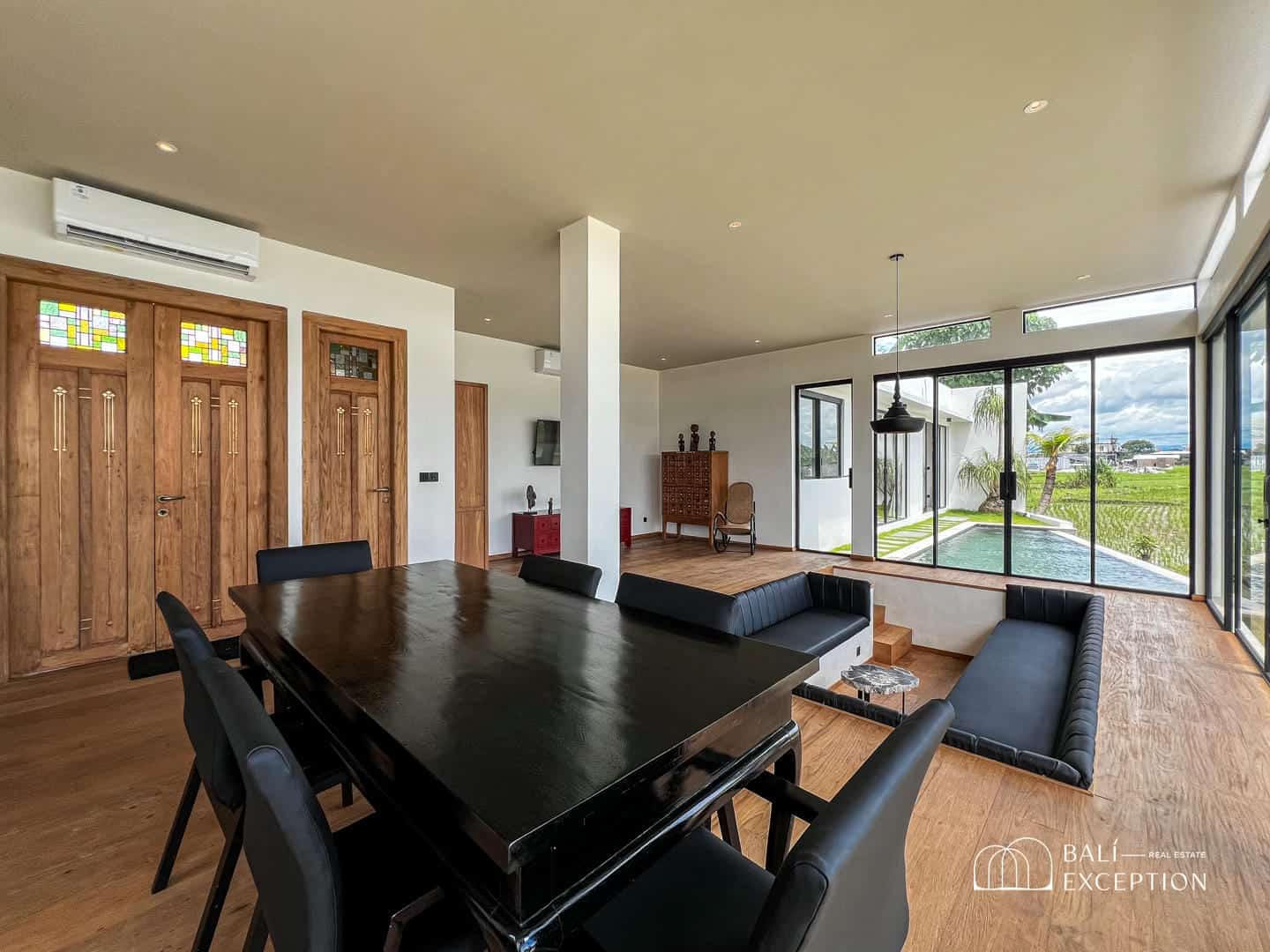 Modern villa living room with pool view
