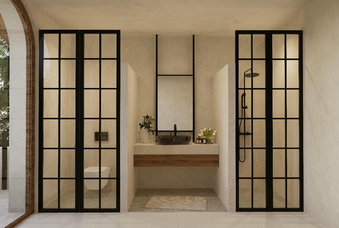 Minimalist bathroom with black framed glass doors.