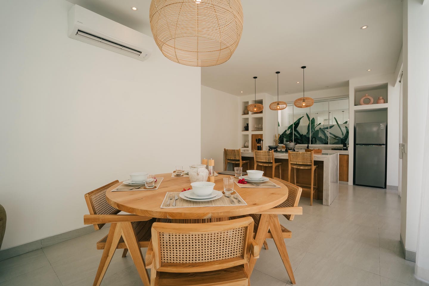 Modern dining room with wooden furniture and decor.