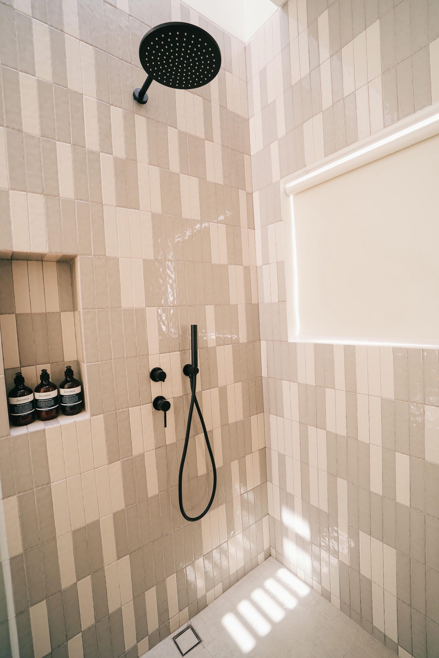 Modern tiled shower with rainfall showerhead